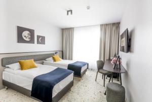 Postel nebo postele na pokoji v ubytování Antares Hotel