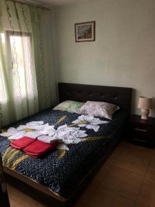 a bedroom with a bed with towels on it at Apartments Dubrava 106 in Dobra Voda