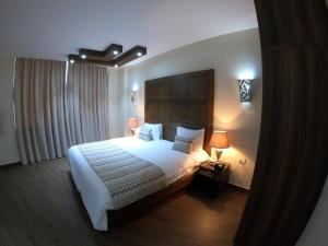 Postel nebo postele na pokoji v ubytování Eden Hotel