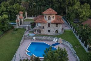 an aerial view of a house with a swimming pool at Exclusive house Legacy in Smederevo