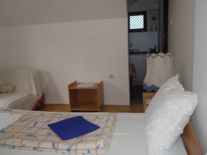 Postel nebo postele na pokoji v ubytování Apartmani Sobe BILJANA