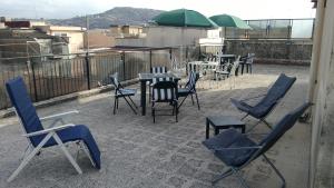 a group of chairs and tables on a roof at B&B Cavour in Carlentini
