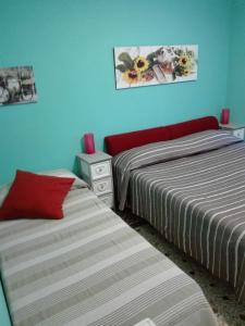 Un pat sau paturi într-o cameră la La Casa di Rosco