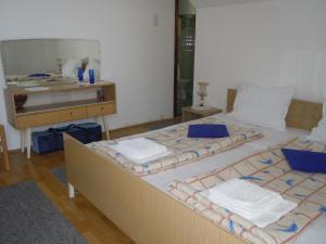 Postel nebo postele na pokoji v ubytování Apartmani Sobe BILJANA