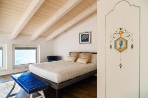 Postel nebo postele na pokoji v ubytování NUMA HOTEL