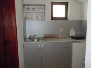 Kuchyň nebo kuchyňský kout v ubytování Apartmani Sobe BILJANA