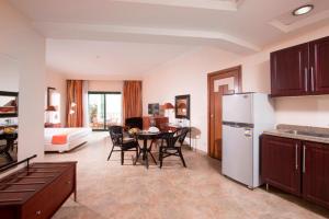 A kitchen or kitchenette at Swiss Inn Plaza Hotel