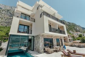 a villa with a view of the ocean at Boutique Hotel Casa del Mare - Vizura in Kotor