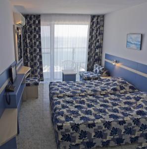 Un pat sau paturi într-o cameră la Palace Hotel - Half Board