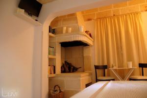 Postel nebo postele na pokoji v ubytování B&B Luvì