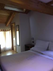 Katil atau katil-katil dalam bilik di Chalet Delle Rose