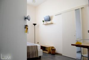 TV a/nebo společenská místnost v ubytování B&B Luvì