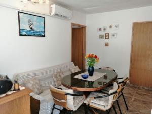 a living room with a table and a couch at Apartment Zarace in Zarače