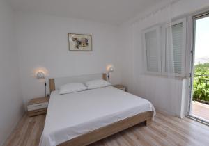 Posteľ alebo postele v izbe v ubytovaní Apartments Jere Proto