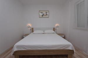 Posteľ alebo postele v izbe v ubytovaní Apartments Jere Proto