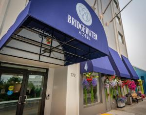 a blue awning on the front of a building at Bridgewater Hotel, Trademark Collection by Wyndham in Fairbanks