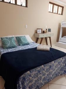 Cama ou camas em um quarto em Divino Lugar