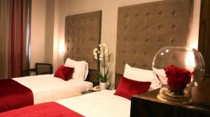 Postel nebo postele na pokoji v ubytování Eden Hotel