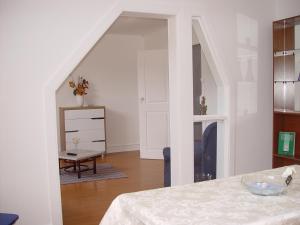 a bedroom with a stairway leading to a living room at António Augusto Apartment in Coimbra