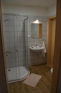 a bathroom with a shower and a sink at Apartmány Réví in Hlohovec