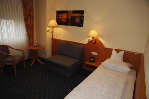 Postel nebo postele na pokoji v ubytování Hotel Anika
