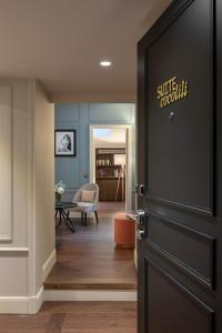 a door with a sign that reads silk covenant in a hallway at Royal Madeleine Hotel & Spa in Paris