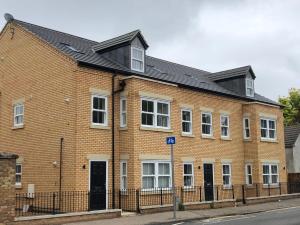 a large brick building on the side of a street at The Martins in Peterborough