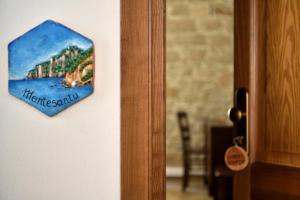 a sign on a door that says theresaurus at Hotel Goloritzé in Baunei