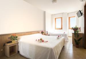 Postel nebo postele na pokoji v ubytování Hotel Esperia