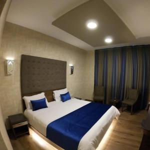 Postel nebo postele na pokoji v ubytování Eden Hotel