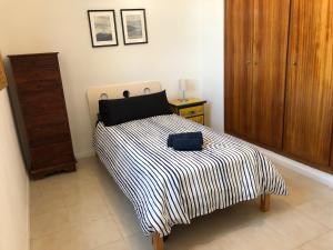 Posteľ alebo postele v izbe v ubytovaní Apartamento Puerto de Sagunto Playa