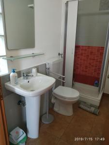 a bathroom with a sink and a toilet and a shower at Santa e Maria Affittacamere in Lamezia Terme