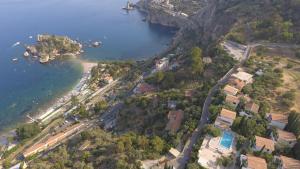 an aerial view of a beach and the water at Residence Terra Rossa Taormina in Taormina