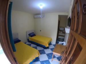 Cama ou camas em um quarto em Pousada 277