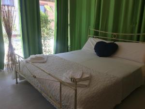 Postel nebo postele na pokoji v ubytování Villa Irma guest house