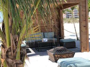 a patio with two chairs and a table and a table at ICONA Diamond Beach in Wildwood Crest