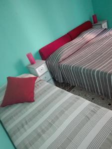 Un pat sau paturi într-o cameră la La Casa di Rosco
