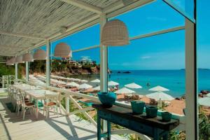 a restaurant on the beach with a view of the ocean at Apartment Gendar Delux, Sunny Island, Chernomorets in Chernomorets