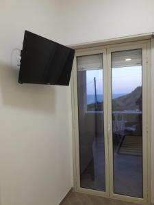 TV a/nebo společenská místnost v ubytování AL FARO