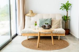 a coffee table in a living room with a couch at SECRET HILL in Athani