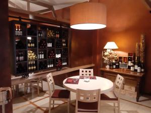 a wine tasting room with a table and chairs at Vivo Hotel in Pieve a Nievole