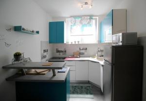 Kuchyň nebo kuchyňský kout v ubytování Apartment Kala