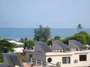 a white house with a solarium on top of it at Vistazul Rentals in San Clemente