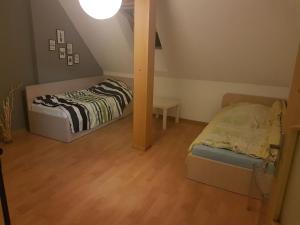 Posteľ alebo postele v izbe v ubytovaní pokoje Łagodzińska