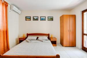 Letto o letti in una camera di Villa Dionis