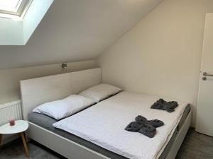 Voodi või voodid majutusasutuse Penzion Apartmány Adamčík toas