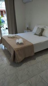 Postel nebo postele na pokoji v ubytování Joy Apartments Zakynthos + 37 fotografií