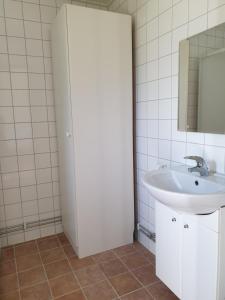 a bathroom with a sink and a mirror at Vandrarhem & Lofthus Solstickan Mellbystrand in Mellbystrand +93 photos