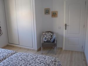 Łóżko lub łóżka w pokoju w obiekcie Clara's sun apt
