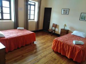 Giường trong phòng chung tại El Tuco Hotel +65 ảnh